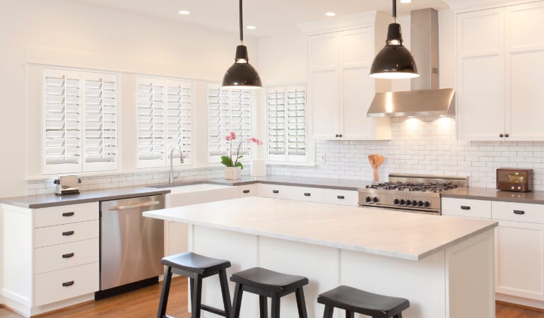 Plantation shutters in a bright Houston kitchen.